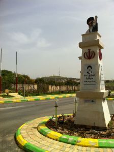 Traffic Circle in Kfar Kila, Lebanon, with Israel town Metula in background