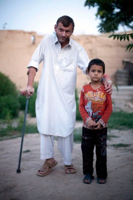 Image: Gennady Tseuma, with his son, Samiullah