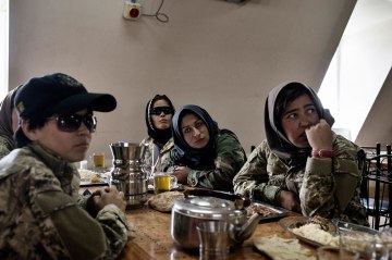 Habibi and her fellow special forces recruits at a mess hall on a training base outside Kabul. Afghanistan's military employs women to help in night raids against insurgents.