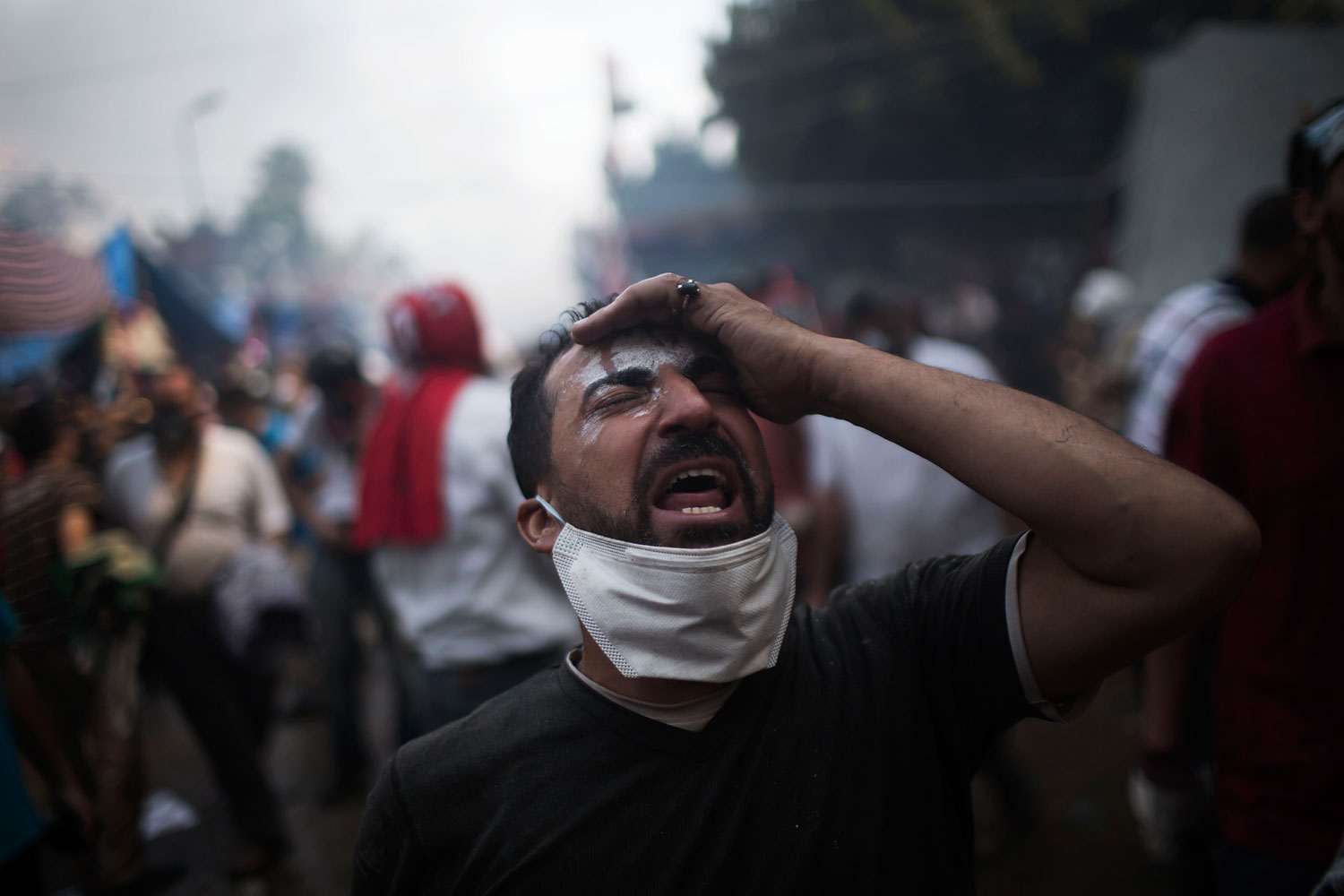 A supporter of ousted Egyptian President Mohammed Morsi reacts during clashes with Egyptian security forces in Rabaah Al-Adawiya in Cairo's Nasr City district, Aug. 14, 2013.