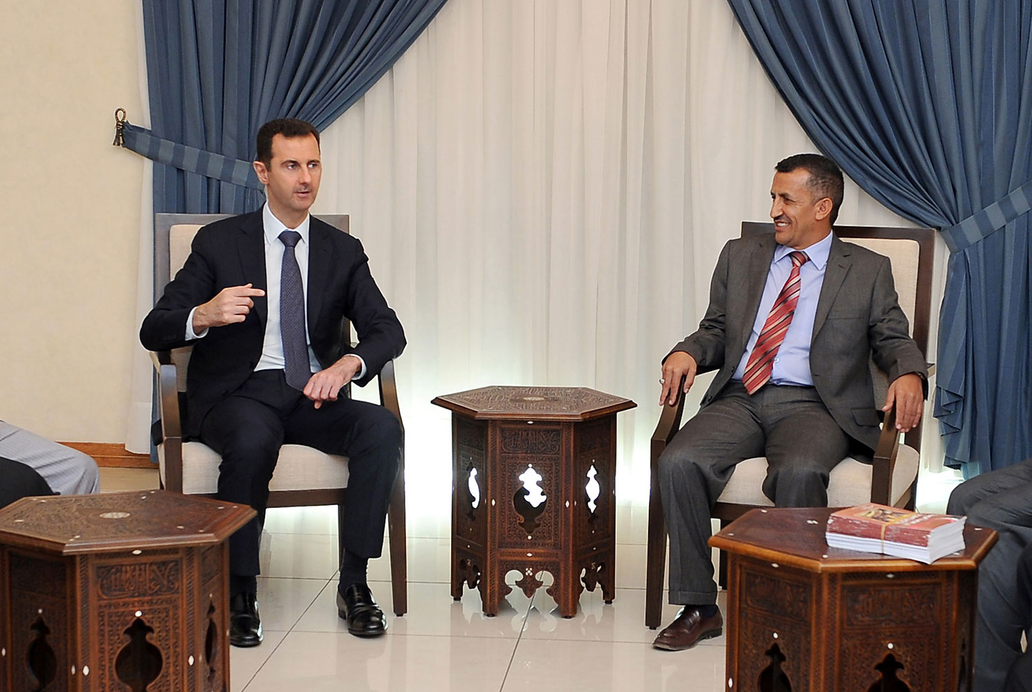 A handout picture released by the Syrian Arab News Agencyon August 29, 2013 shows Syrian President Bashar al-Assad meeting with a Yemeni delegation of politicians in Damascus.