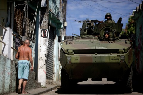 Brazilian Navy soldiers patrol in an armoured vehicle during an operation against drug dealers at Mineira slum in Rio de Janeiro