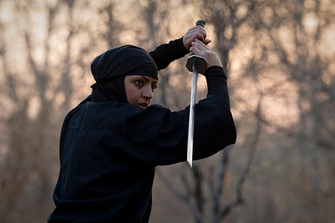 A Ninjutsu practitioner participates in a sword drill 