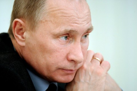 Russian PM Putin listens during a cabinet meeting in Moscow