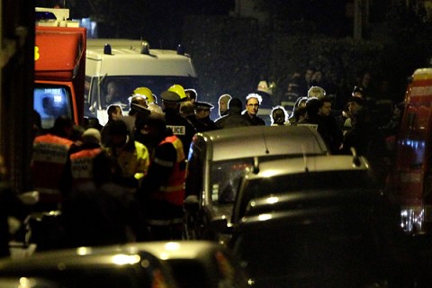French police and emergency services gather on a street during a raid on a building to arrest a suspect in the killings of three children and a rabbi on Monday at a Jewish school, in Toulouse