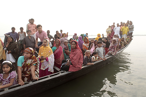 Relatives arrive at the site of a ferry accident on the river Meghna in Munshiganj district