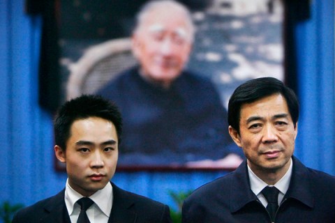 File photo of Bo Xilai and his son Bo Guagua at a mourning hall in Beijing