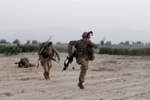 U.S. Army soldiers from 4-73 Cavalry Regiment, 82nd Airborne Division run for cover as they are fired upon by Taliban fighters during a mission in Zhary district of Kandahar province