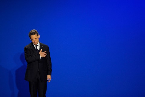 France's President Sarkozy reacts as he leaves the stage during a campaign rally in Saint Maurice