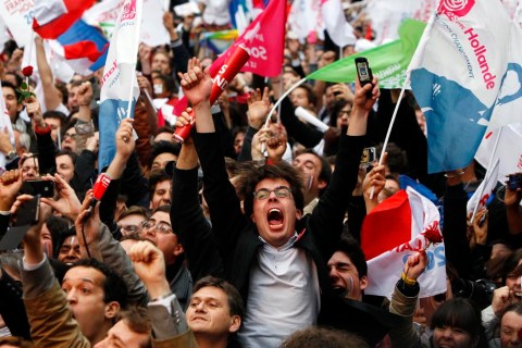 Supporters of Francois Hollande react after hearing election results outside the  Socialist Party campaign headquarters in Paris, France, on Sunday, May 6.