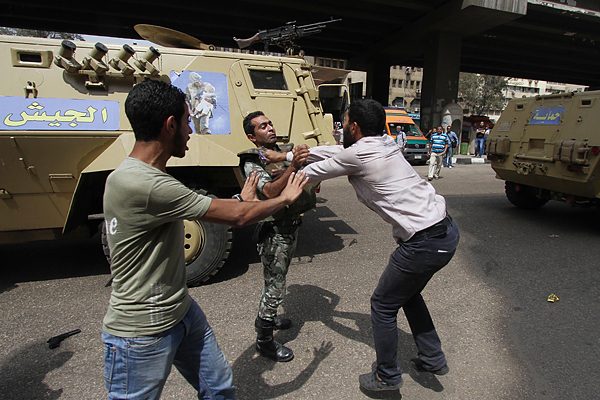 At least 20 were killed and more than 100 injured in Cairo amid clashes involving pro-democracy protesters irate at the ruling interim military government