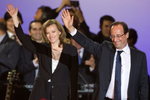 France's newly-elected President Francois Hollande and his companion Valerie Trierweiler celebrate on stage during a victory rally at Place de la Bastille in Paris