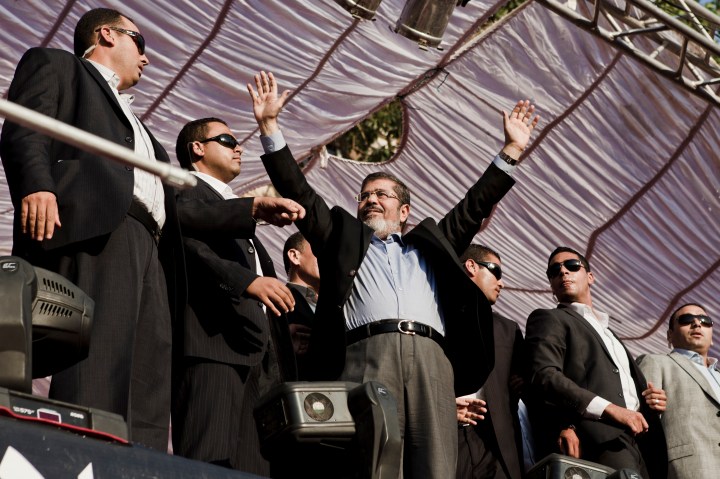 image: Egyptian President-elect Mohamed Morsi arrives on stage in Tahrir Square on June 29, 2012, in Cairo, Egypt. 