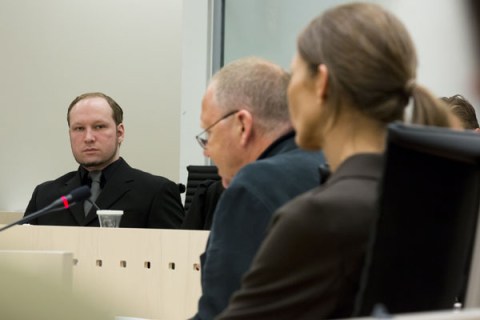 Anders Behring Breivik (C) looks on duri