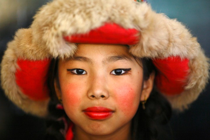 Tibetan girl dressed in traditional attire is pictured during 77th birthday celebration of exiled spiritual leader Dalai Lama in Kathmandu