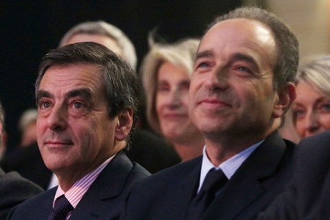 France's former prime minister Fillon and UMP political party head Cope attend a meeting during the UMP parliamentary day in Marcq en Baroeul