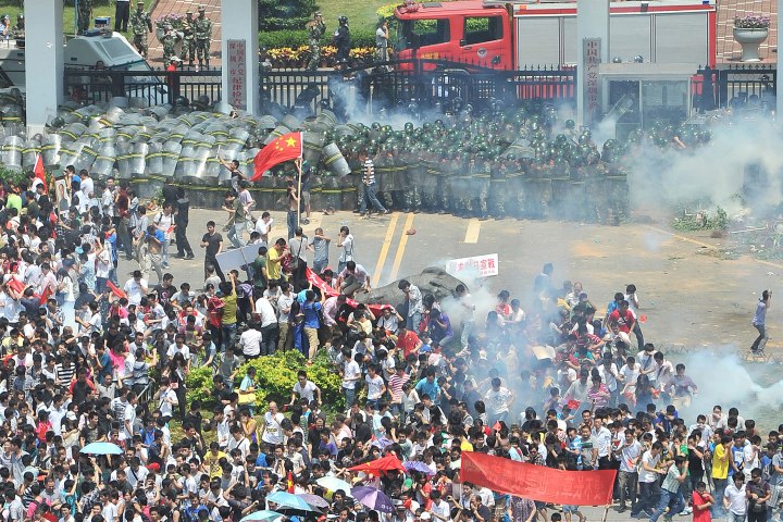 Demonstrators disperse after tear gas was fired
