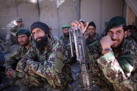 Afghan soldiers observe how to apply a tourniquet during drills at Combat Outpost Garda, Wardak Province.