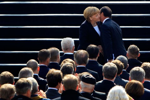 France's President Francois Hollande and Germany's Chancellor Angela Merkel kissing each other during anniversary ceremony in castle Ludwigsburg on Sept. 22, 2012. 