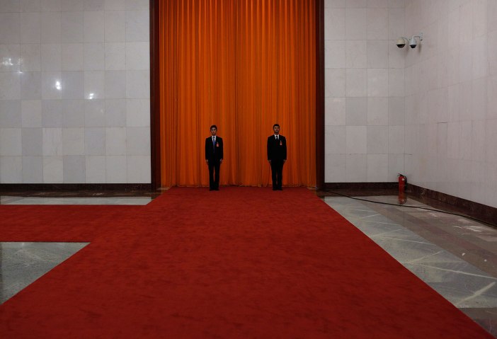 Chinese security personnel stand guard in the Great Hall of the People during the 18th Communist Party Congress in Beijing,  Nov. 9, 2012. 