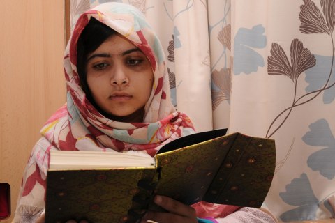 image: Malala Yousafzai reads a book in an undated handout photo released Nov. 9, 2012