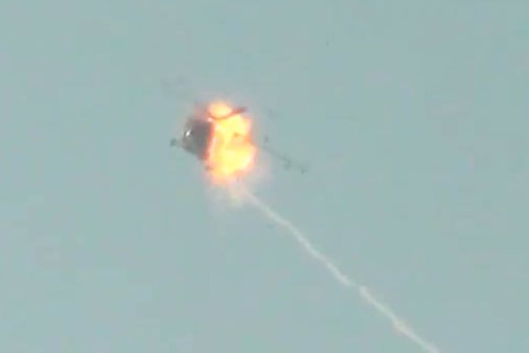Screen grab from video footage from anti-government source claiming to show a Russian-made attack helicopter taking fire in mid-flight from rebel forces on the ground in Syria. Posted on YouTube on Nov. 27, 2012.