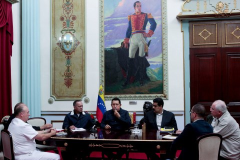 Venezuelan President Hugo Chavez speaks next to his inner circle members during a national broadcast at Miraflores Palace in Caracas Dec. 8, 2012. 