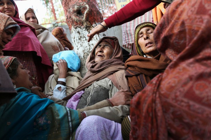 image: Unidentified women console the mother (C) of Subash Tomar during his funeral in New Delhi, India, Dec. 25, 2012. Tomar who was injured in Sunday's clashes with people protesting against the brutal gang-rape of a woman on a moving bus died in hospital Tuesday. 