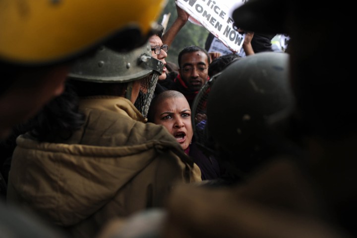 image: Demonstrators shout slogans and wave placards as they move towards India Gate in New Delhi on Dec. 27, 2012, during a protest calling for better safety for women following the rape of a student in the Indian capital. Protests across India over the last week against sex crimes have denounced the police and government, with the largest in New Delhi at the weekend prompting officers to cordon off areas around government buildings. One policeman was killed and more than 100 people injured in the violence. 