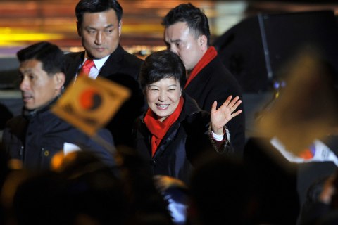 image: South Korea's president-elect Park Geun-Hye waves to supporters as she arrives to deliver a victory speech on a stage in the centre of Seoul, Dec. 19, 2012.   