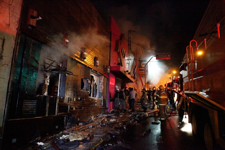 Firefighters try to extinguish a fire at Boate Kiss nightclub in the southern city of Santa Maria, Jan. 27, 2013. 