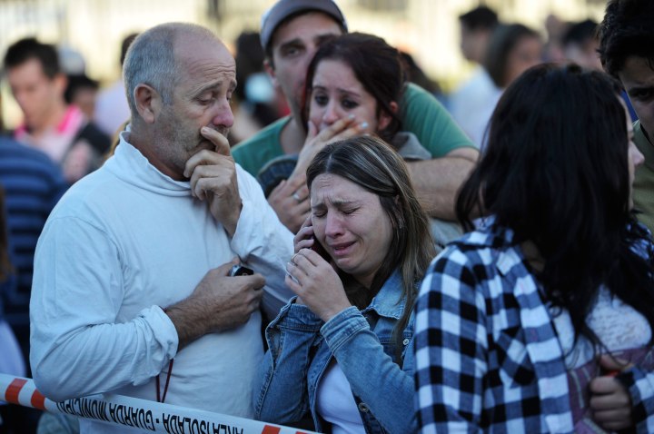 Relatives of the Boate Kiss nightclub victims cry near the scene in the southern city of Santa Maria, Brazil, Jan. 27, 2013. 