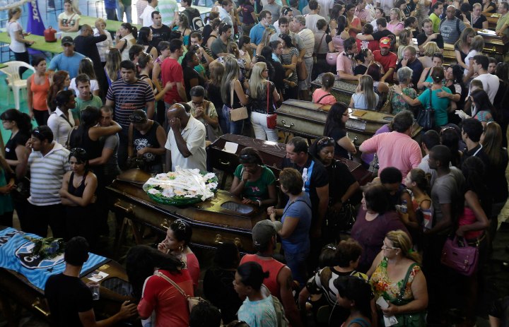 Relatives of victims of the fire at Boate Kiss nightclub attend a collective wake in the southern city of Santa Maria, Brazil, Jan. 27, 2013.