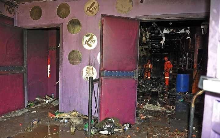 Rescue workers investigate Kiss nightclub after a deadly fire broke out in Santa Maria, Brazil, Jan. 27, 2013. 