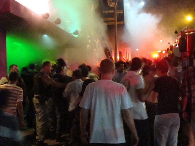 A crowd stands outside the Boate Kiss nightclub during a fire inside the club in Santa Maria, Brazil,, Jan. 27, 2013.  