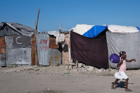image: A Haitian girl walks through a camp for people displaced by the January 2010 earthquake in Port-au-Prince, Jan. 3, 2013.