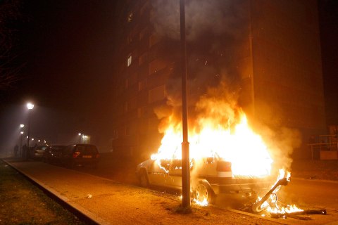 image: A car burns after being torched during New Year celebrations in Strasbourg's district of Neuhof, France, Jan. 1, 2013.