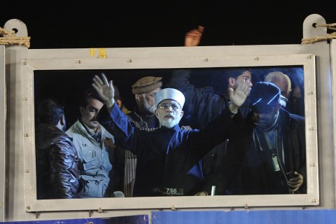 Tahir ul Qadri, a prominent religious scholar, talks to supporters during a sit-in protest in Islamabad.