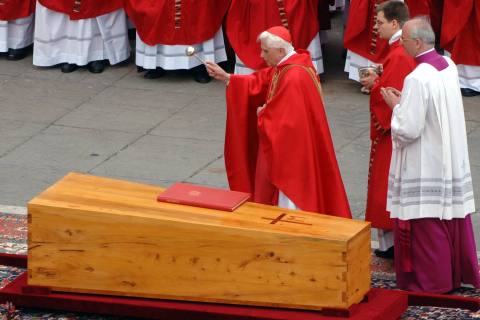 German Cardinal Joseph Ratzinger blesses the coffin of Pope John Paul II during his funeral in Saint Peter's Square, April 8, 2005.
