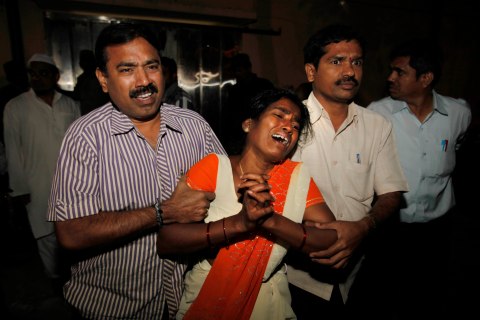 A woman cries out after seeing the body of her husband who was killed in a bomb blast in Hyderbad, India.