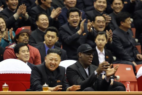 North Korean leader Kim Jong Un, left, and former NBA star Dennis Rodman watch North Korean and U.S. players in an exhibition basketball game at an arena in Pyongyang, North Korea
