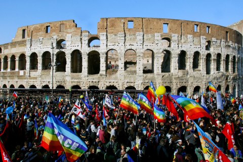 Anti-war protesters march in front of Rome's ancient Colosseum during a demonstration against war in Iraq.