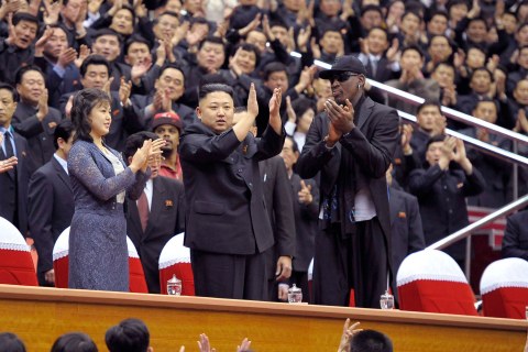 North Korean leader Kim Jong-Un, his wife Ri Sol-Ju and former NBA basketball player Dennis Rodman clap during an exhibition basketball game in Pyongyang.