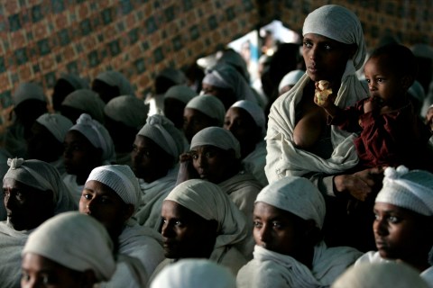 Jewish Ethiopian women attend a morning prayer service at a compound while awaiting immigration to Israel in Gondor