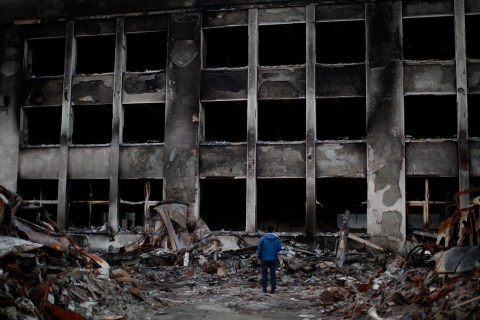 A man overlooks a burned Kadonowaki elementary school in Northern Japanese city, Ishinomaki.