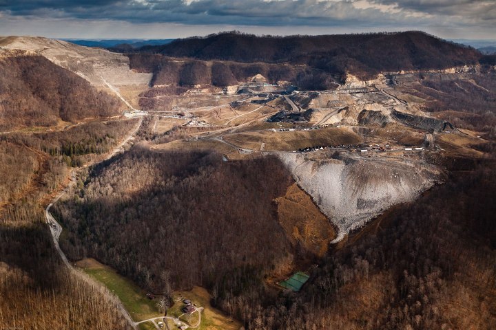 A Mountaintop Removal mine site and its accompanying valley fill hovers over a resident's home in Fayette County, WV. This site is operated by Frasure Creek Mining LLC which was sued in 2010 by four environmental groups for violations regarding their MTR in Kentucky. They were accused of committing over 20,000 water discharge violations and fraud for falsifying reports.