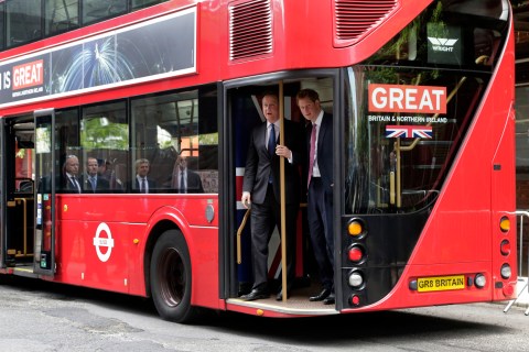 From left: Prime Minister David Cameron and Prince Harry arrive by New London Bus for the GREAT event, in New York CIty, on May 14, 2013.
