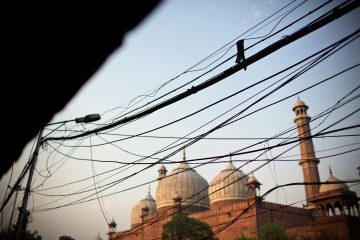Telephone wires hang near Jama Masjid in Old Delhi on, May 3 2013.