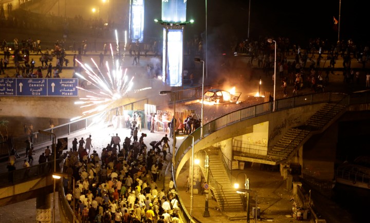 Supporters and opponents of Egypt's Islamist President Mohammed Morsi  clash in Cairo, on July 5, 2013.