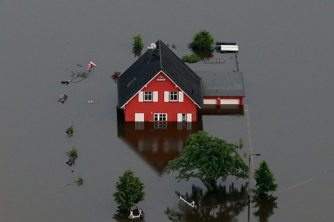 A house is inundated by the Elbe river near the village of Fischbeck, in the federal state of Saxony Anhalt